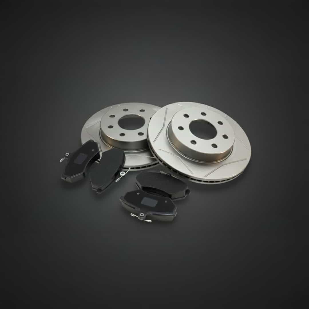 A person wearing red gloves is installing or inspecting a car’s brake disc and caliper. The image shows a close-up of the vehicle’s exposed wheel hub and brake assembly.