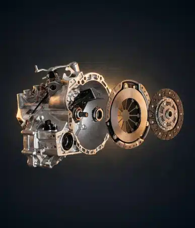 A car transmission system with internal components and clutch parts is shown in an exploded view against a dark background.